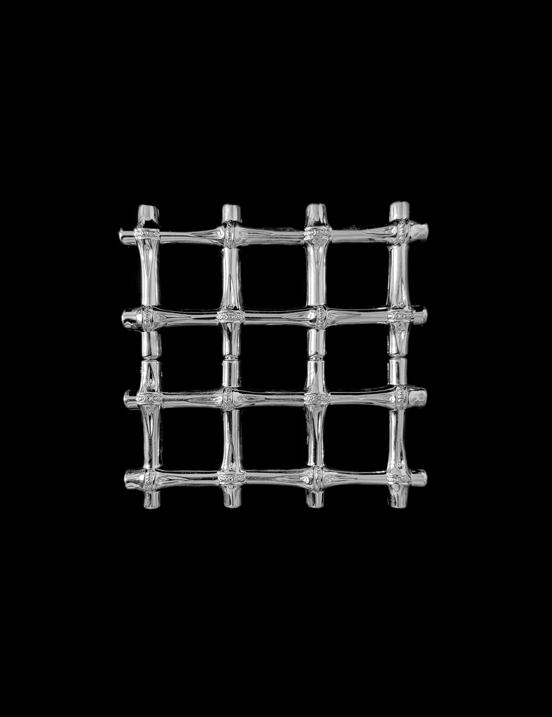 A vintage silver plated trivet