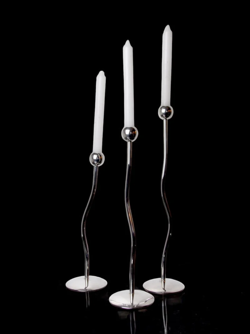 Trio of silver metal candlesticks from mesa italy, italy, 1980s
